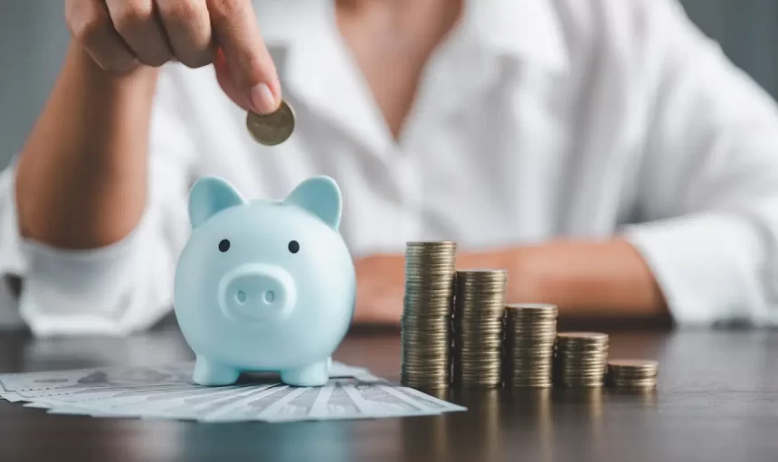 Saving investment banking finance concept. Stack of coins with piggy bank on the table. Growth of loan and investment business idea. Asset Management, Funds, Liabilities, Deposits, Income, Successful.